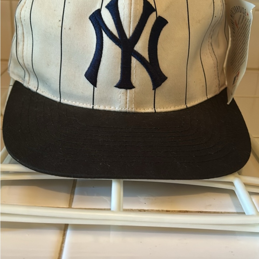 Genuine Merchandise White and Black Hat